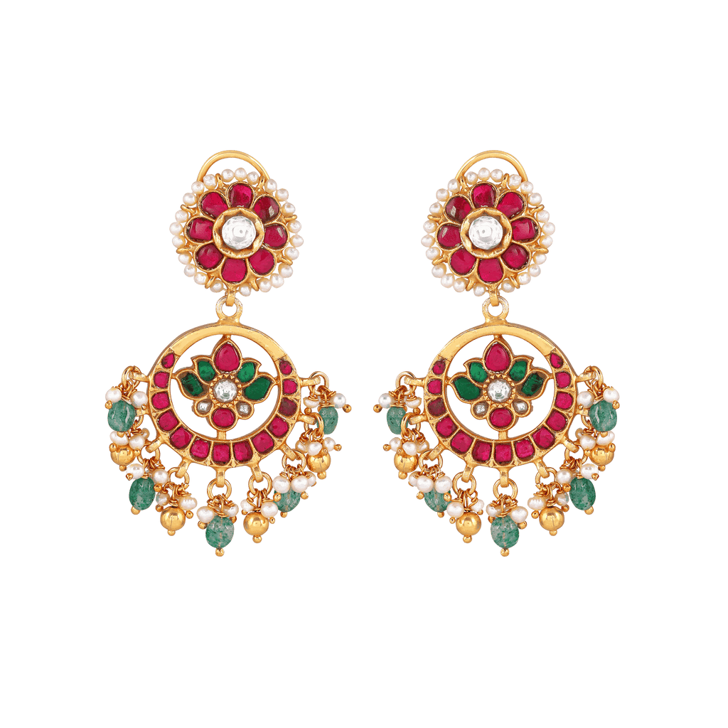 92.5 Silver gold-plated chandbali earrings with kundan pattern featuring red, green stones, seed pearls, and floral motifs.
