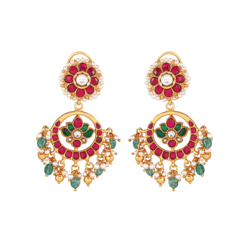 92.5 Silver gold-plated chandbali earrings with kundan pattern featuring red, green stones, seed pearls, and floral motifs.
