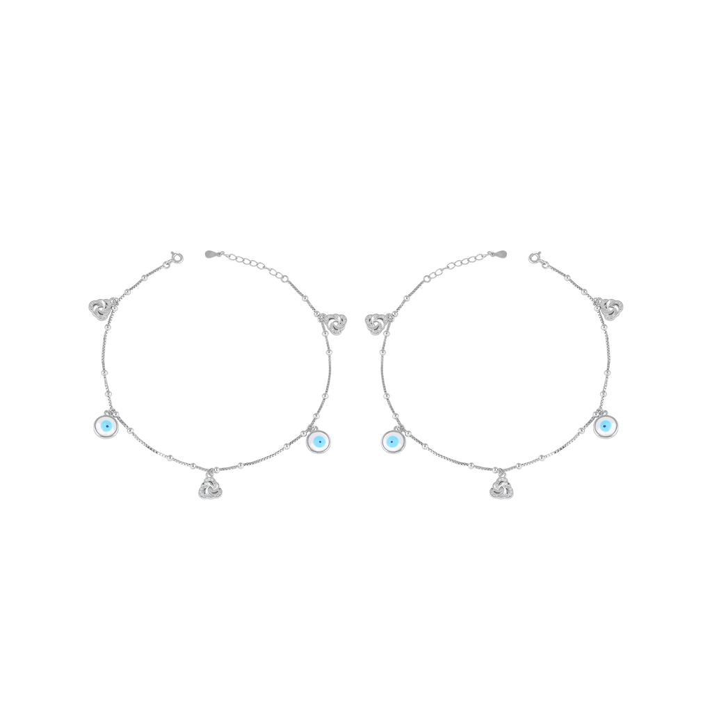 Pair of Silver Evil Eye Anklet with light blue enamel charms, sparkling cubic zirconia love knots, and polished silver balls on delicate chains.