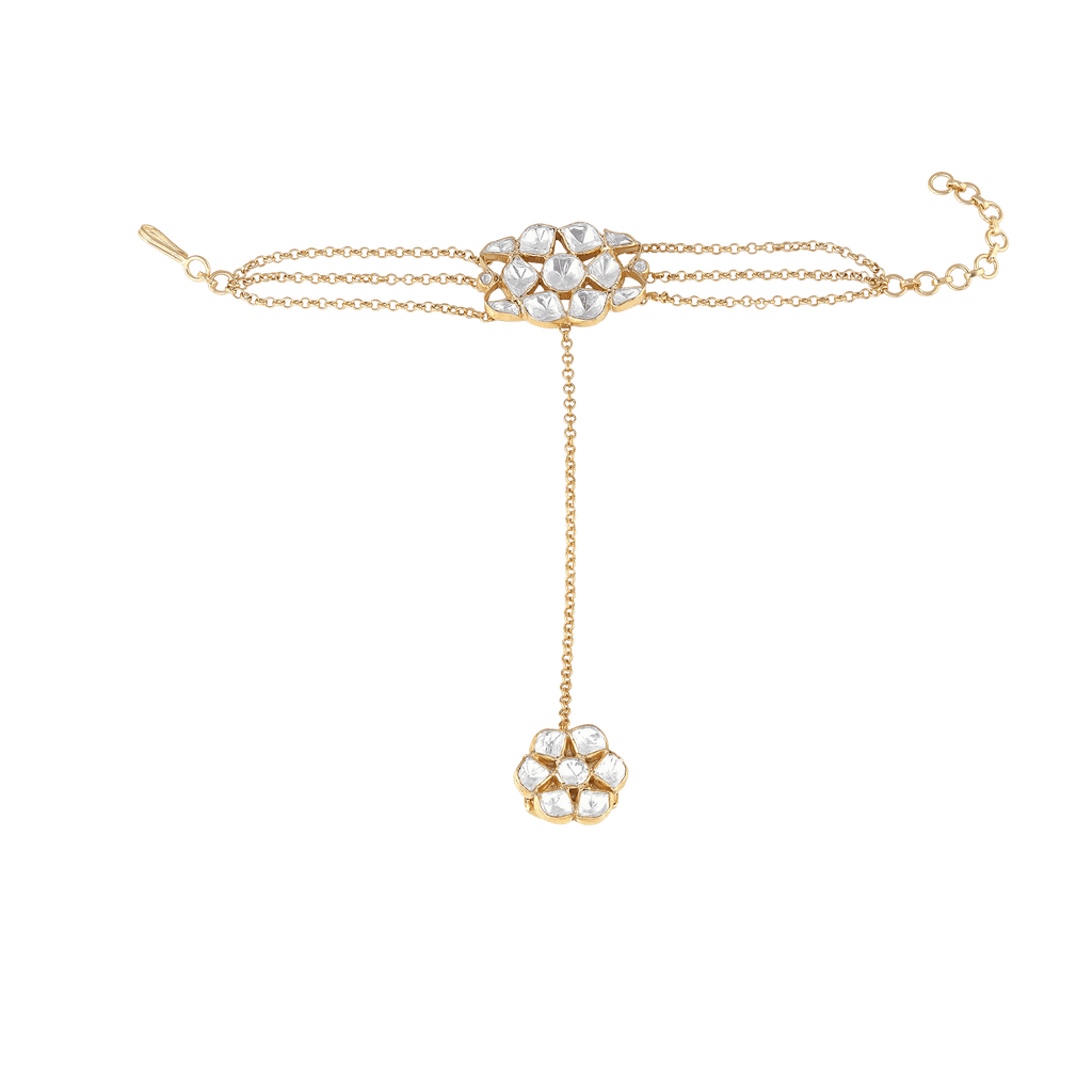 Gold-Plated Silver Polki Haath Phool featuring floral clusters with white stones, connected by a delicate gold chain and adjustable strap.