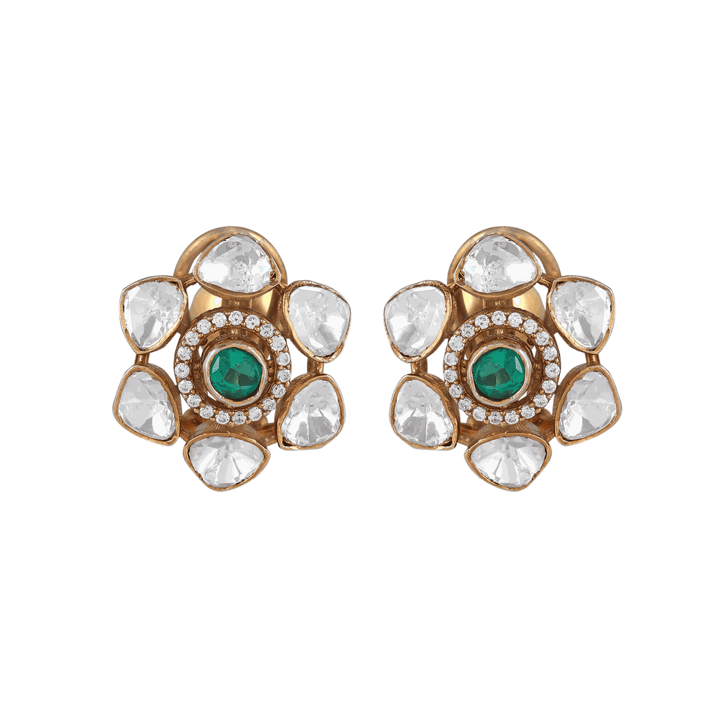 Silver Floral Studs featuring a gold polish, green center stone, and clear petal-shaped cubic zirconia arranged in a flower pattern.