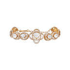 Vintage Polki-Style gold-plated silver bracelet with a four-leaf clover floral motif and clear cubic zirconia stones in circular links.