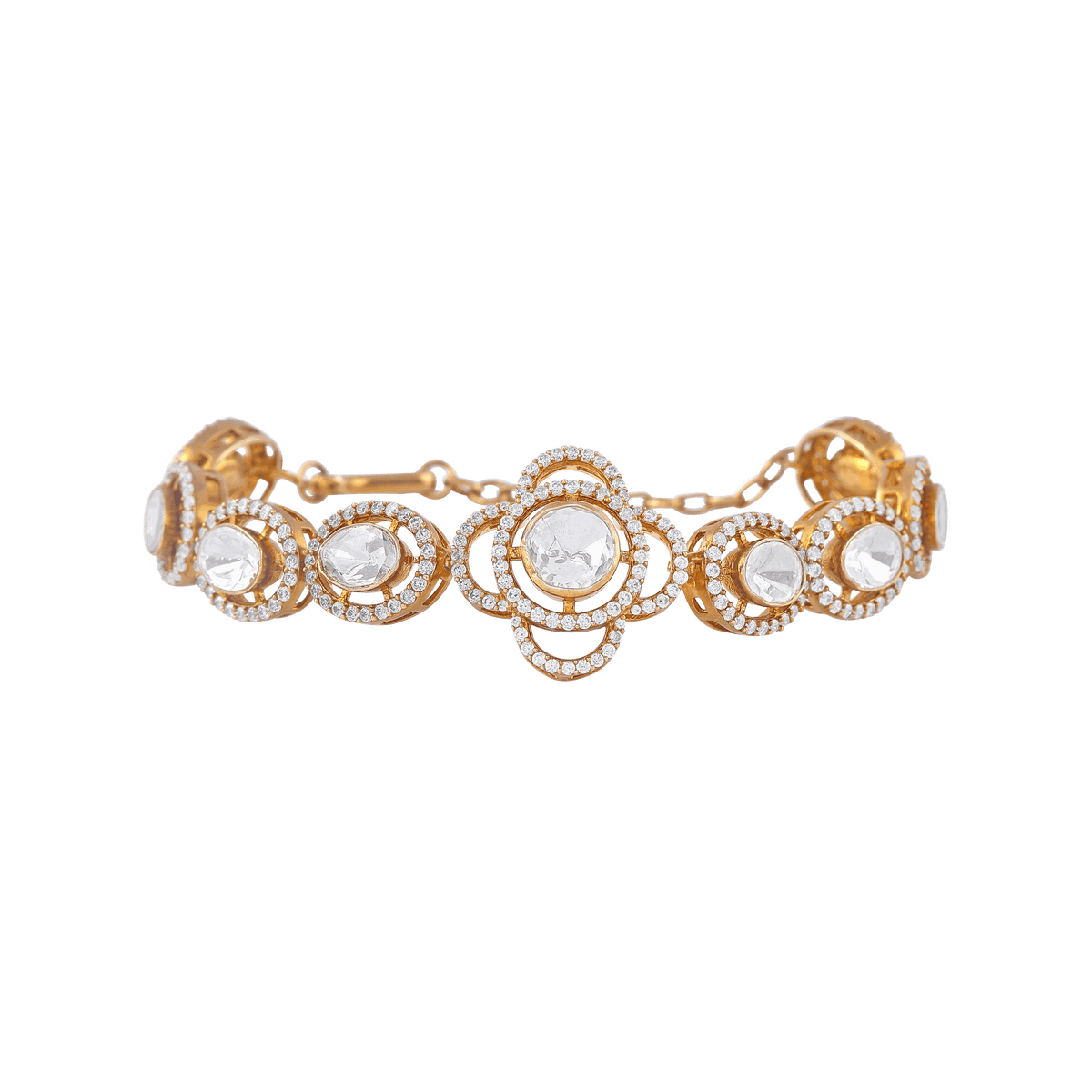 Vintage Polki-Style gold-plated silver bracelet with a four-leaf clover floral motif and clear cubic zirconia stones in circular links.