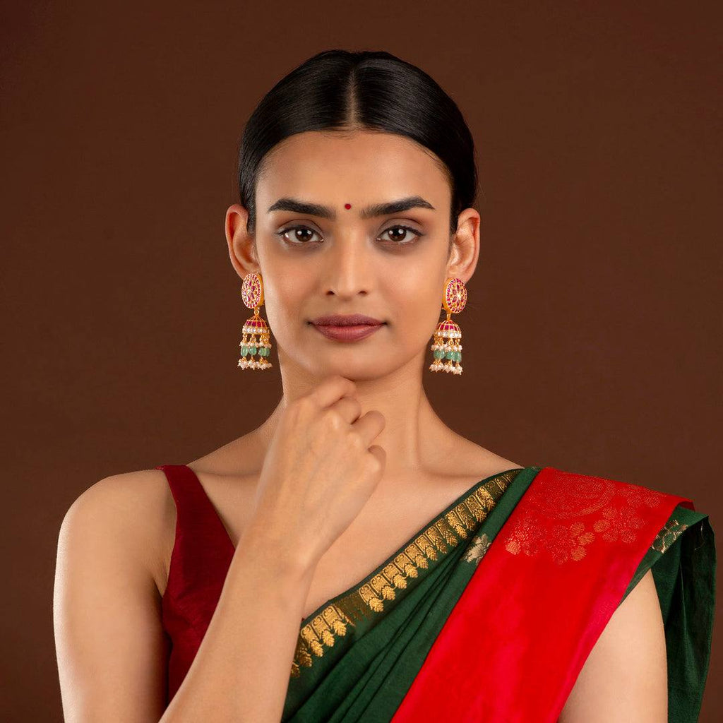 Floral Kundan Pattern Silver Jhumkas by Tavya Jewellery - styled close-up