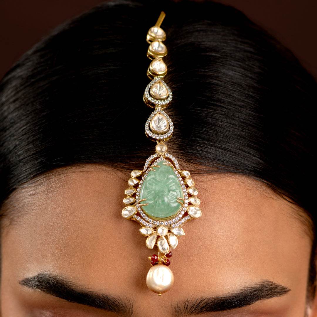 Silver Polki Maang Tikka with Pear-Cut Green Stone by Tavya Jewellery - side view