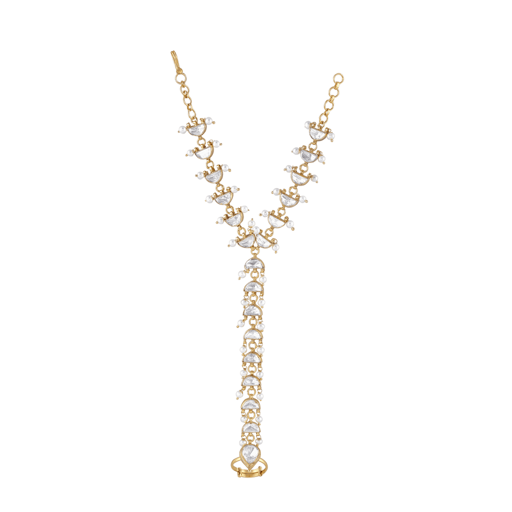 Silver Kundan Haath Phool with gold-plated crescent-shaped motifs, white kundan stones, and delicate pearl accents in a hand-harness design.
