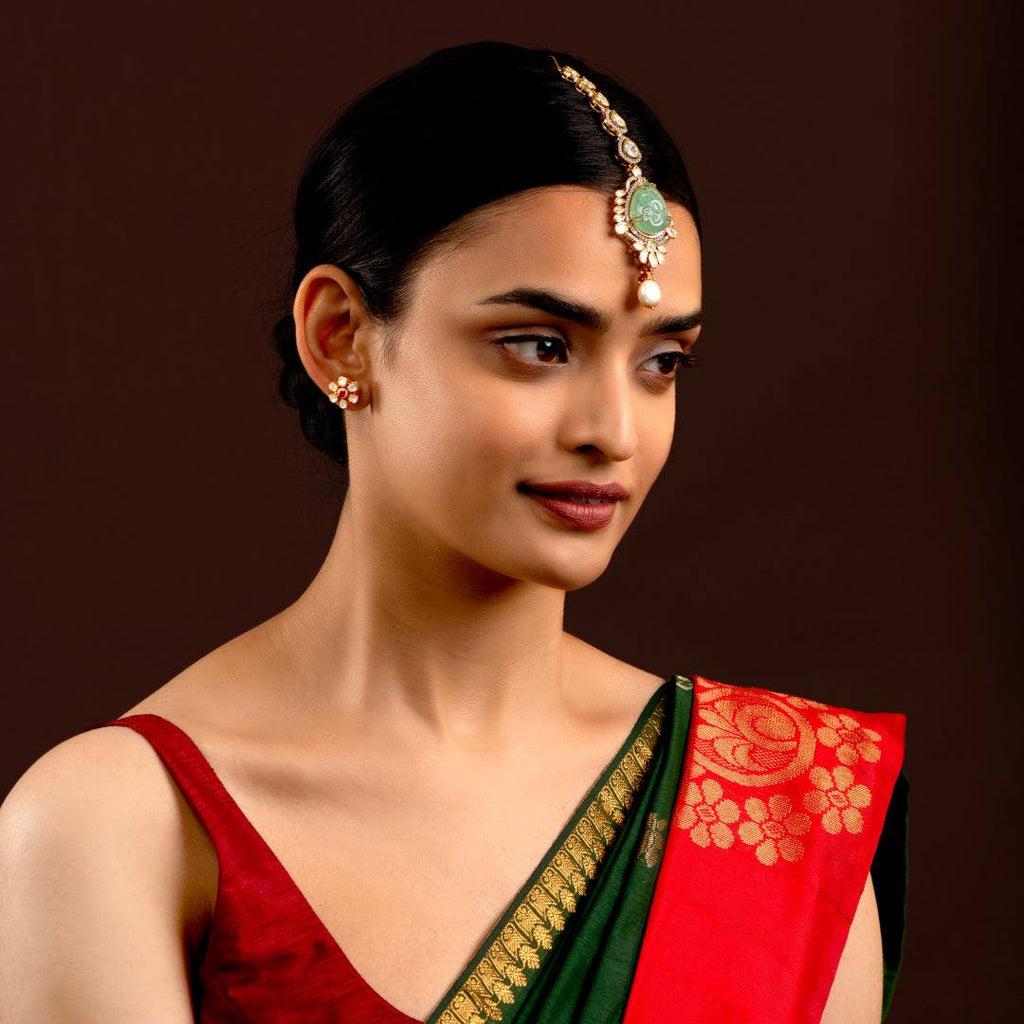Silver Polki Maang Tikka with Pear-Cut Green Stone by Tavya Jewellery - styled close-up