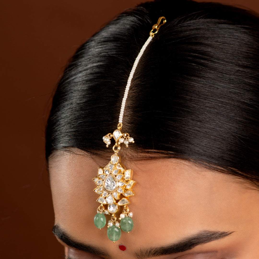Silver Maang Tikka with Pearls and Green Beads by Tavya Jewellery - styled close-up