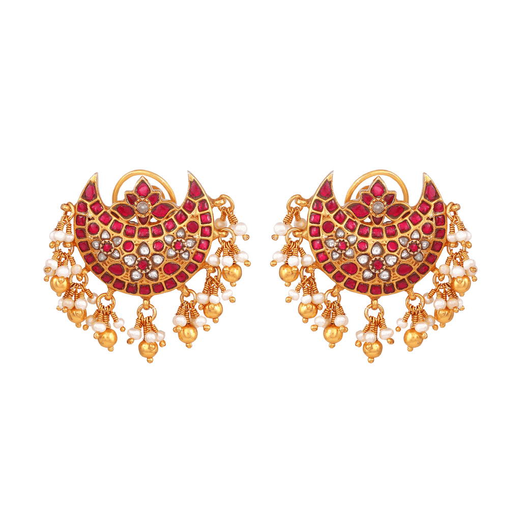 Silver Chandbali Earrings with gold plating, red Kundan stones, clear CZ stones, and pearl and gold ball fringe detailing.