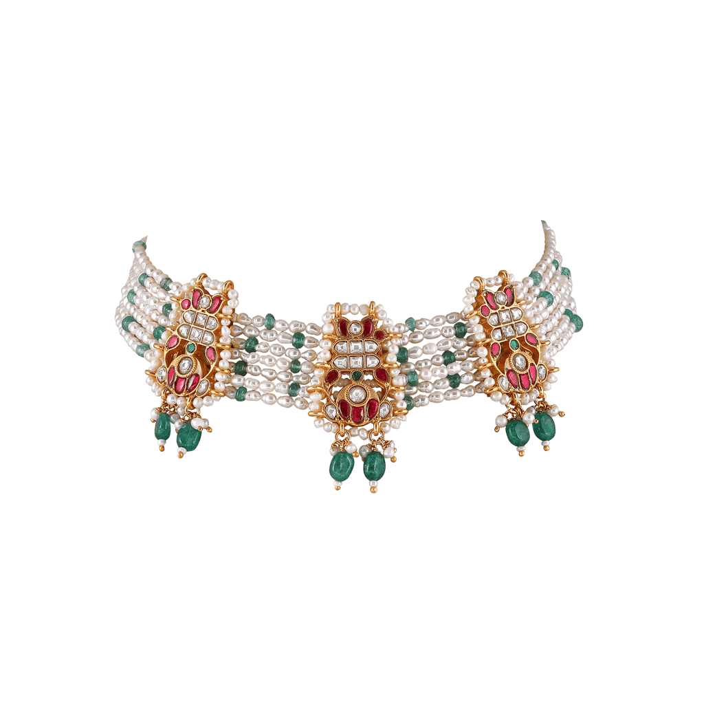 92.5 Silver Kundan choker featuring multiple strands of white pearls with gold-tone medallions set with kundan stones, red rubies, and green emerald drops.