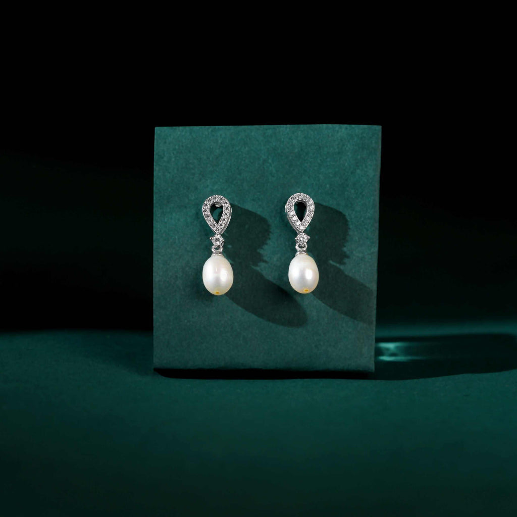White Pearl Drop Earrings Adorned with Sparkling Stones by Tavya Jewellery - close-up detail