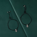 Oxidized Silver Flower Charm Black Thread Anklets by Tavya Jewellery - front view