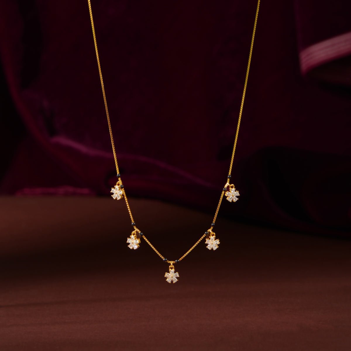 Gold Floral Drop Chain by Tavya Jewellery - close-up detail