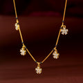Gold Floral Drop Chain by Tavya Jewellery - front view