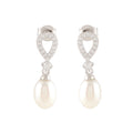 White Pearl Drop Earrings featuring teardrop-shaped silver studs with sparkling stones and dangling oval pearls.