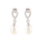 White Pearl Drop Earrings featuring teardrop-shaped silver studs with sparkling stones and dangling oval pearls.