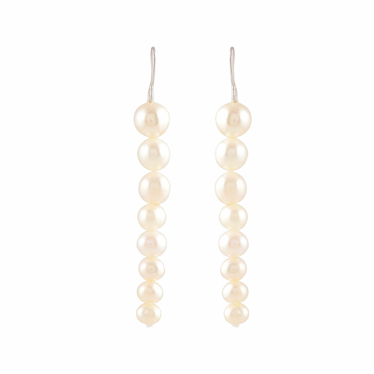 Pearl Descent drop earrings featuring a graduated line of round white pearls with silver hooks for elegant wear.