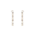 Orbit Pearl Stud Earrings featuring a vertical row of white pearls and silver textured accents in a compact design.