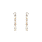Orbit Pearl Stud Earrings featuring a vertical row of white pearls and silver textured accents in a compact design.