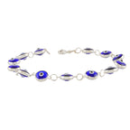 Minimalist Blue Enamel Evil Eye Bracelet featuring circular blue and white enamel charms set in polished 92.5 silver links