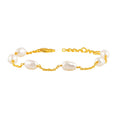 Organic Freshwater Pearl Link Silver Bracelet with gold-plated chain and irregular white pearls showcasing an elegant, delicate design.