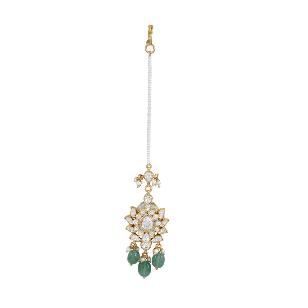 Silver Maang Tikka featuring a starburst pattern with clear stones, green beads, and a pearl-linked chain with gold accents.