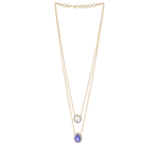 Halo Double-Layered Necklace in gold-tone metal featuring a round clear stone and a blue teardrop pendant with a halo border.