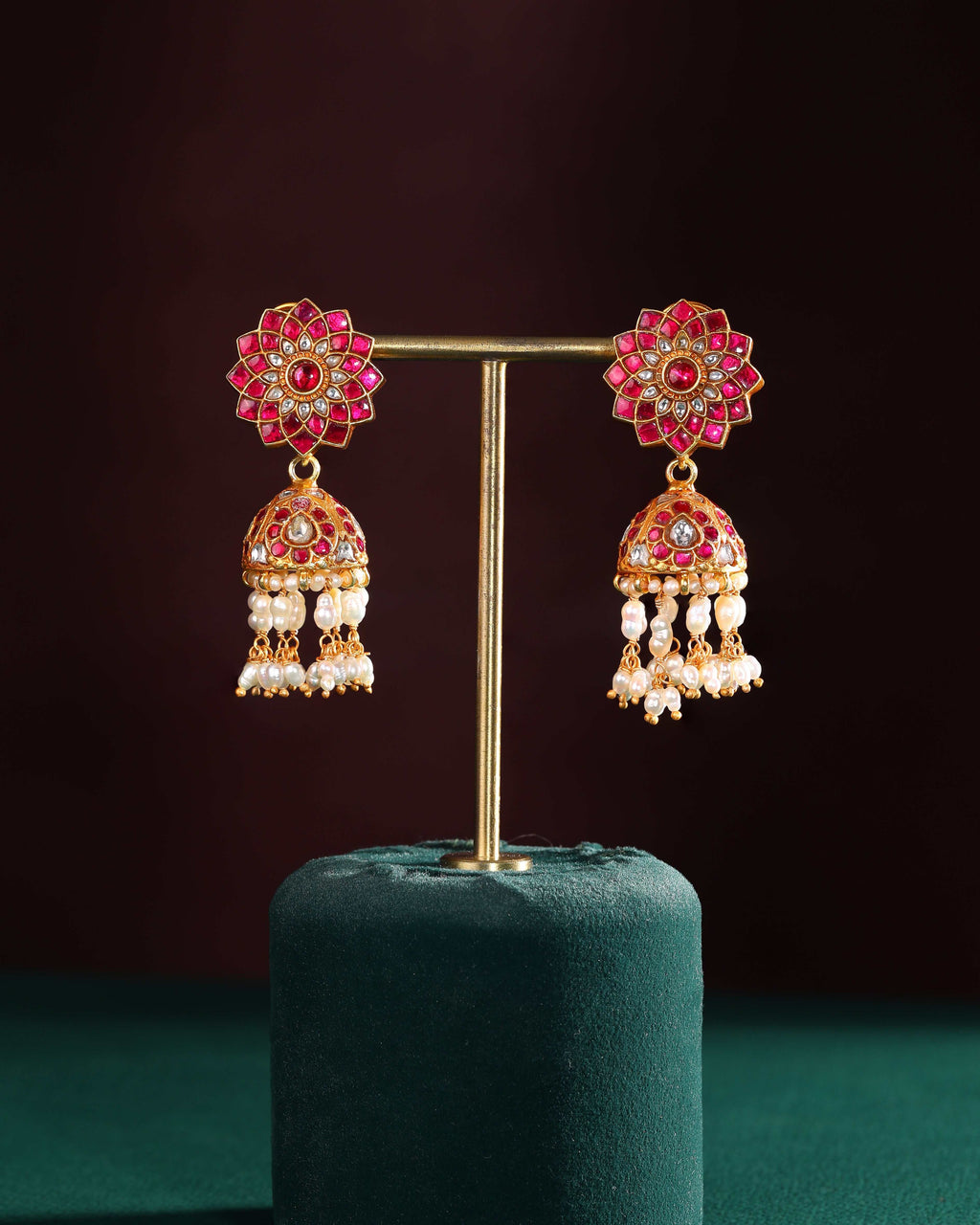 Silver Jhumkas With Floral Pattern by Tavya Jewellery - close-up detail