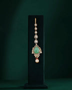 Silver Polki Maang Tikka with Pear-Cut Green Stone by Tavya Jewellery - close-up detail