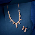 Rose Gold Baguette jewelry set featuring a delicate floral cluster necklace and matching drop earrings with baguette and marquise stones