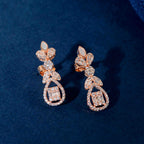Rose Gold Baguette drop earrings with floral inspired design featuring baguette, marquise, and round clear stones in rose gold tone